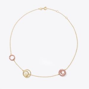 TORY BURCH MILLER RINGS NECKLACE IN GOLD AND PINK.